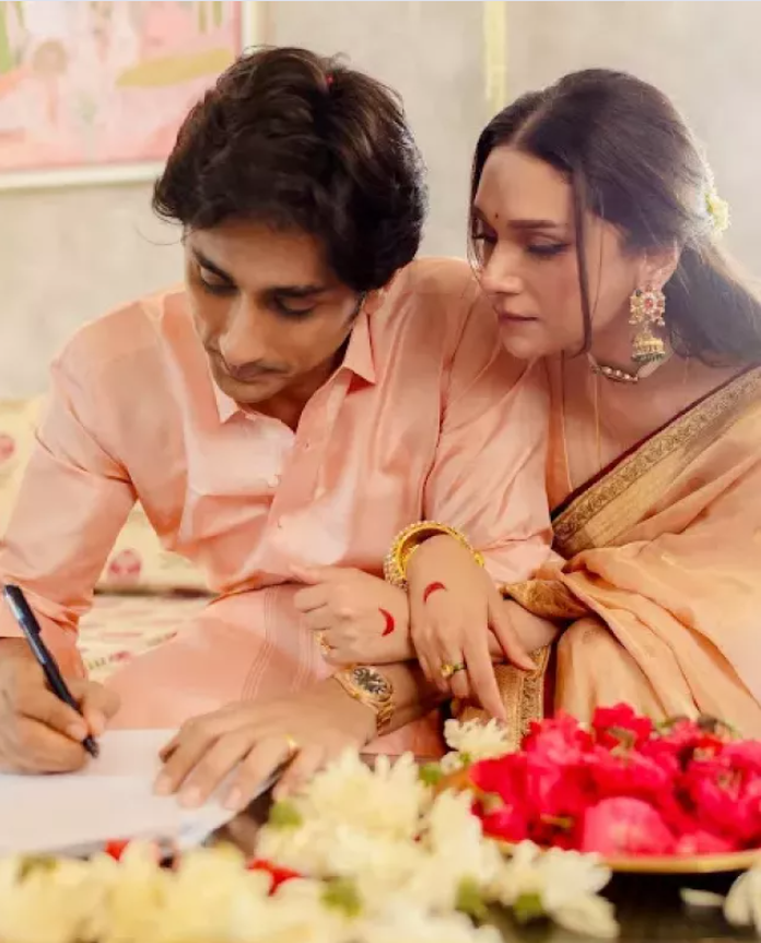 Siddharth was spotted signing a registration with Aditi Rao Hydari